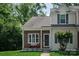 Charming two-story townhome with brick facade, well-kept lawn, and inviting front porch at 327 Wilkes Place Dr, Fort Mill, SC 29715