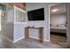 Open living area featuring wood floors, a console table, and a view into the bedroom at 327 Wilkes Place Dr, Fort Mill, SC 29715