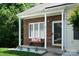 Cozy covered porch area with a bench, perfect for relaxing outdoors at 327 Wilkes Place Dr, Fort Mill, SC 29715