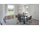 Dining area with a table, chairs, and natural light from the windows at 4045 Port Richmond Ave # 10, Gastonia, NC 28056