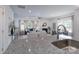 Open-concept kitchen with granite counters and stainless appliances overlooks a bright living room and dining area at 4045 Port Richmond Ave # 10, Gastonia, NC 28056