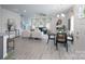 Bright, open-concept living area with luxury vinyl plank flooring, a cozy fireplace, and stylish furnishings at 4045 Port Richmond Ave # 10, Gastonia, NC 28056