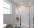 Modern shower features white subway tile, glass door and walls, and shower bench at 4045 Port Richmond Ave # 10, Gastonia, NC 28056