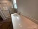 Bathroom with modern vanity, neutral paint, and shower in the background at 4049 Port Richmond Ave # 10, Gastonia, NC 28056