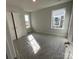 Bedroom with windows, neutral paint, and closet door at 4049 Port Richmond Ave # 10, Gastonia, NC 28056