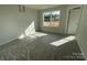Bright bedroom with a view of construction outside the window at 4049 Port Richmond Ave # 10, Gastonia, NC 28056
