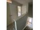 Hallway with multiple doors, neutral paint, and stairway leading to rooms on other floor at 4049 Port Richmond Ave # 10, Gastonia, NC 28056