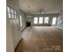 Unfurnished living room with fireplace and many windows providing natural light at 4049 Port Richmond Ave # 10, Gastonia, NC 28056