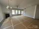 Spacious and bright unfurnished living room with a fireplace and windows at 4049 Port Richmond Ave # 10, Gastonia, NC 28056