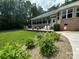 Expansive backyard with a deck, lush landscaping, and beautiful surroundings at 408 Emerald Bay Dr, Salisbury, NC 28146