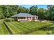 Fenced-in backyard with large lawn and deck at 408 Emerald Bay Dr, Salisbury, NC 28146