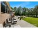 Inviting backyard featuring a spacious deck, comfortable seating, flowers, and well-manicured lawn at 408 Emerald Bay Dr, Salisbury, NC 28146