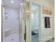 This recently renovated bathroom features a glass shower and adjoins a smaller toilet room at 408 Emerald Bay Dr, Salisbury, NC 28146