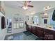 A bright, airy bathroom features a double vanity and large arched window at 408 Emerald Bay Dr, Salisbury, NC 28146