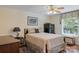 Cozy bedroom with hardwood floors, wooden furnishings and a window view at 408 Emerald Bay Dr, Salisbury, NC 28146