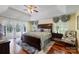 Spacious bedroom with a decorative ceiling fan, detailed curtains and a large window view at 408 Emerald Bay Dr, Salisbury, NC 28146