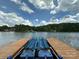 Dock boat lift ready for a boat, overlooking the tranquil lake and scenic surroundings at 408 Emerald Bay Dr, Salisbury, NC 28146