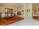 Spacious dining room featuring hardwood and tile floors, with a view into the living room at 408 Emerald Bay Dr, Salisbury, NC 28146
