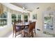 Cozy dining area featuring a wooden table, six chairs, large windows, and natural light at 408 Emerald Bay Dr, Salisbury, NC 28146