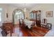 Sophisticated dining room with hardwood floors, decorative window treatment, and elegant china cabinet at 408 Emerald Bay Dr, Salisbury, NC 28146