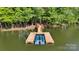 Stunning lakefront home featuring a private dock with boat slips, providing direct access to the water and scenic views at 408 Emerald Bay Dr, Salisbury, NC 28146