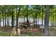 Private dock with multiple levels for seating and grilling in a serene, wooded waterfront setting at 408 Emerald Bay Dr, Salisbury, NC 28146