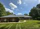 Charming single-story brick home with a lush green lawn and inviting curb appeal at 408 Emerald Bay Dr, Salisbury, NC 28146