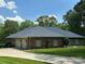 Spacious brick home featuring a three-car garage and well-manicured lawn at 408 Emerald Bay Dr, Salisbury, NC 28146