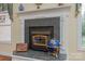 Close-up of a fireplace with decorative mantel, complete with a globe and other accents at 408 Emerald Bay Dr, Salisbury, NC 28146