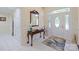 Bright foyer with decorative mirror, tiled floor, and stained glass front door at 408 Emerald Bay Dr, Salisbury, NC 28146