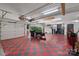 Spacious garage with red and grey checkered floors, ample storage, and work space at 408 Emerald Bay Dr, Salisbury, NC 28146