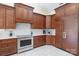 Well-equipped kitchen with stainless steel appliances, wood cabinets, and tile flooring at 408 Emerald Bay Dr, Salisbury, NC 28146
