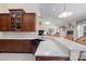Open kitchen with blue farmhouse sink and white countertops with breakfast bar area at 408 Emerald Bay Dr, Salisbury, NC 28146