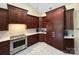 Stylish kitchen with dark cabinets, stainless steel appliances, and granite countertops at 408 Emerald Bay Dr, Salisbury, NC 28146