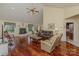 Cozy living room with a fireplace, hardwood floors, and a combination of leather and fabric furniture at 408 Emerald Bay Dr, Salisbury, NC 28146