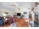 Spacious living room with hardwood floors, high ceilings, a fireplace, and comfortable seating at 408 Emerald Bay Dr, Salisbury, NC 28146