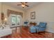 Bright living room with hardwood floors and access to the backyard through French doors at 408 Emerald Bay Dr, Salisbury, NC 28146