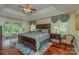 Spacious main bedroom with hardwood floors, large windows, and a sunroom at 408 Emerald Bay Dr, Salisbury, NC 28146