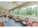 Charming sunroom with tile flooring, lots of natural light, and backyard lake views at 408 Emerald Bay Dr, Salisbury, NC 28146