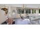 A sunroom featuring tiled floors, rocking chairs, and a view to the garden at 408 Emerald Bay Dr, Salisbury, NC 28146