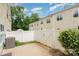 Fully-fenced backyard featuring a concrete patio and lush greenery at 4368 Yoruk Forest Ln, Charlotte, NC 28211