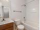 Bathroom featuring wood vanity, a toilet, and tub with shower at 4368 Yoruk Forest Ln, Charlotte, NC 28211