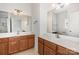 Bathroom boasts dual wood vanities, white counters, and framed mirrors at 4368 Yoruk Forest Ln, Charlotte, NC 28211