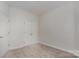 Neutral bedroom features carpeted floor, base molding, and double-door closet at 4368 Yoruk Forest Ln, Charlotte, NC 28211