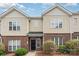 Charming townhome featuring a brick and vinyl exterior with well-maintained landscaping at 4368 Yoruk Forest Ln, Charlotte, NC 28211