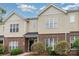 Charming townhome featuring a brick and vinyl exterior with well-maintained landscaping at 4368 Yoruk Forest Ln, Charlotte, NC 28211