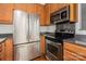 Modern kitchen featuring stainless steel appliances and granite countertops at 4368 Yoruk Forest Ln, Charlotte, NC 28211