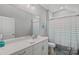 Bright bathroom features modern vanity and tub-shower combo with blue accents at 4532 Stellata Loop, Sherrills Ford, NC 28673