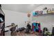 An office area is equipped with exercise equipment in a finished room with a sloped ceiling and hardwood floors at 4532 Stellata Loop, Sherrills Ford, NC 28673