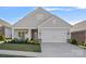 Charming single-Gathering home featuring a two-car garage and a well-manicured lawn with decorative shrubs at 4532 Stellata Loop, Sherrills Ford, NC 28673
